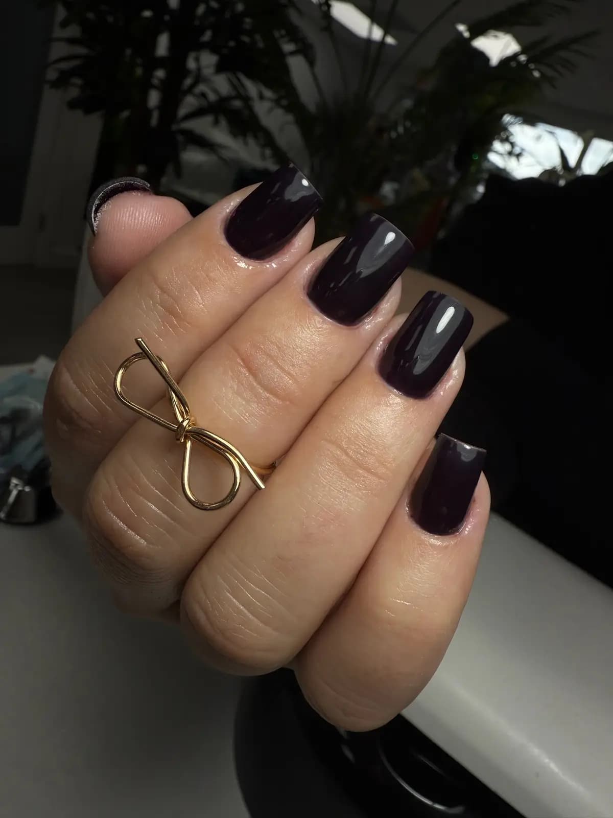 Square nails in deep plum gel with high gloss and tidy cuticles