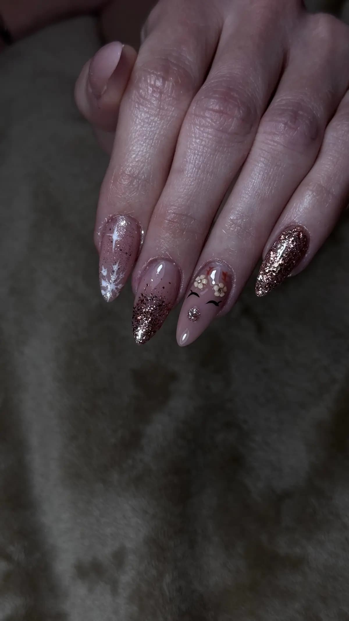Long almond nails in glitter pink with charms and metallic details