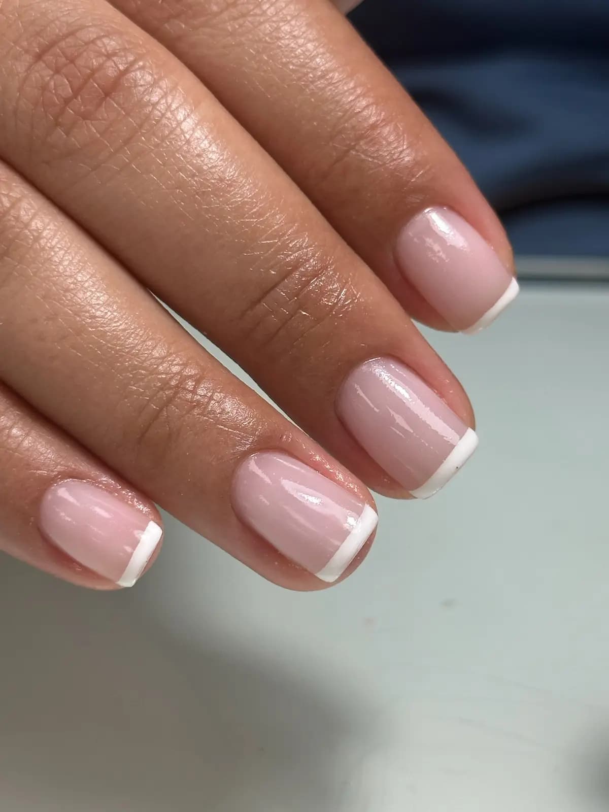 Thin white french on short square nails, clean smile line