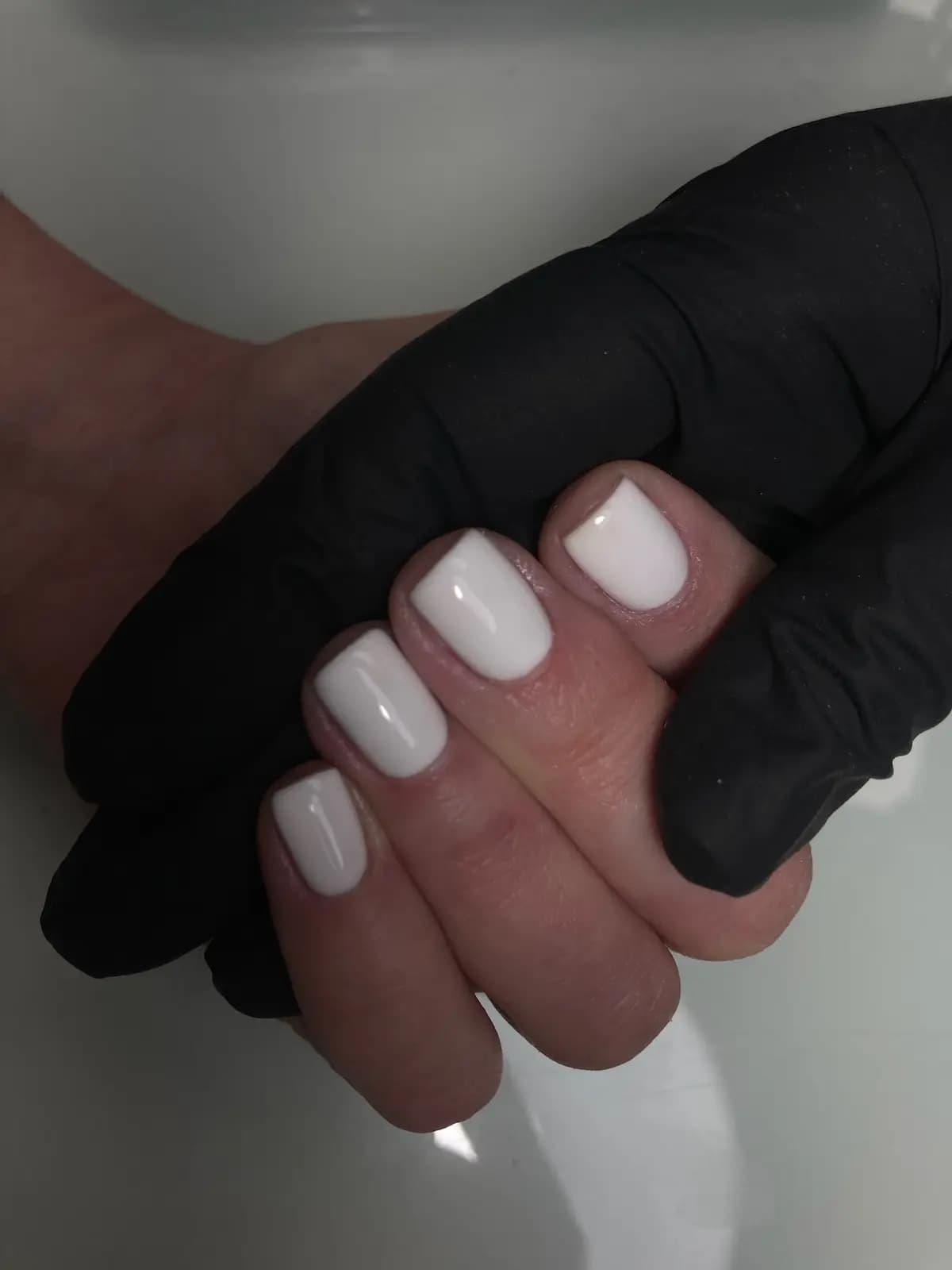 Short square nails in milky white gel, freshly done