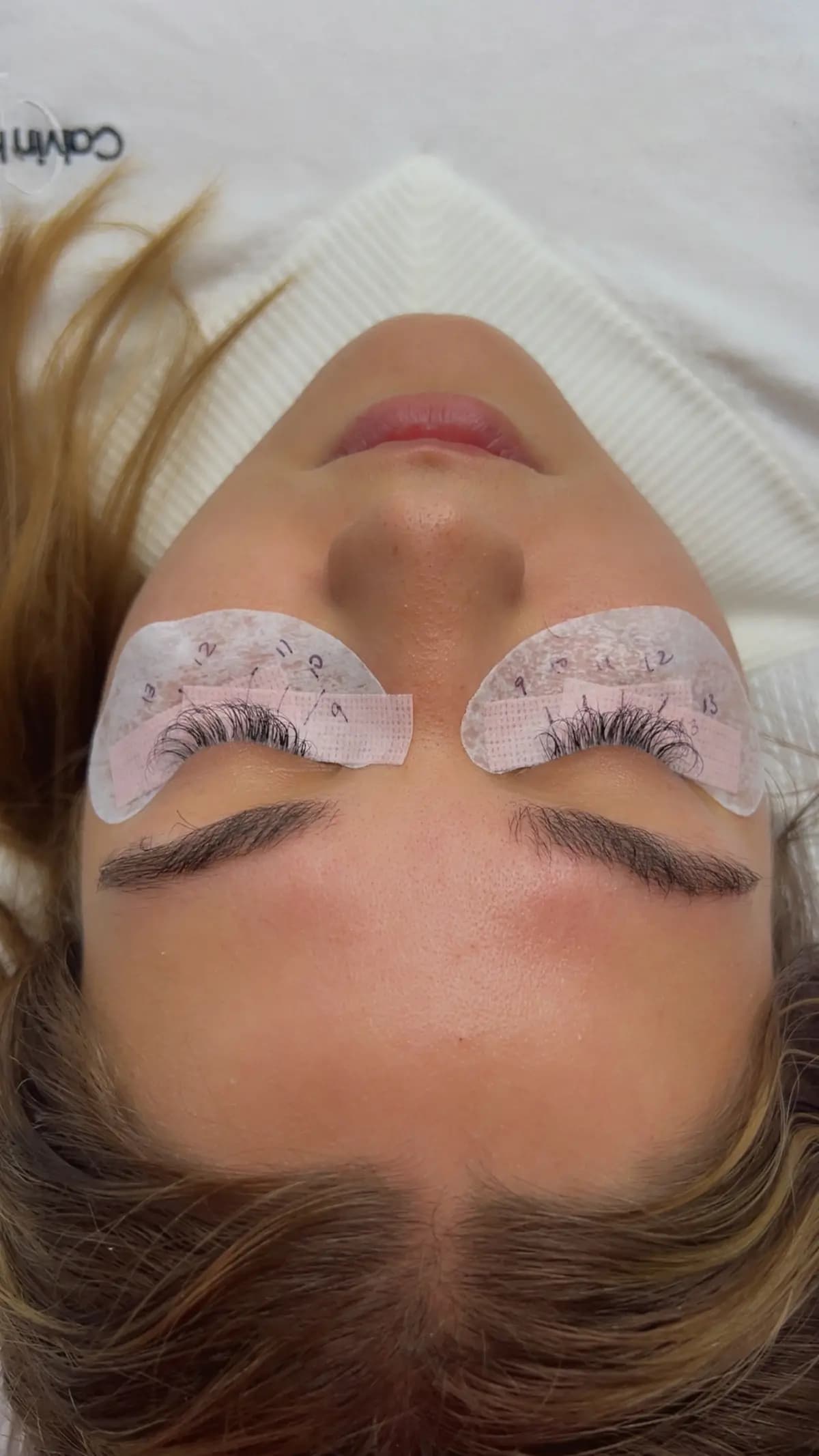 Extensions in progress: under-eye pads and separated lashes