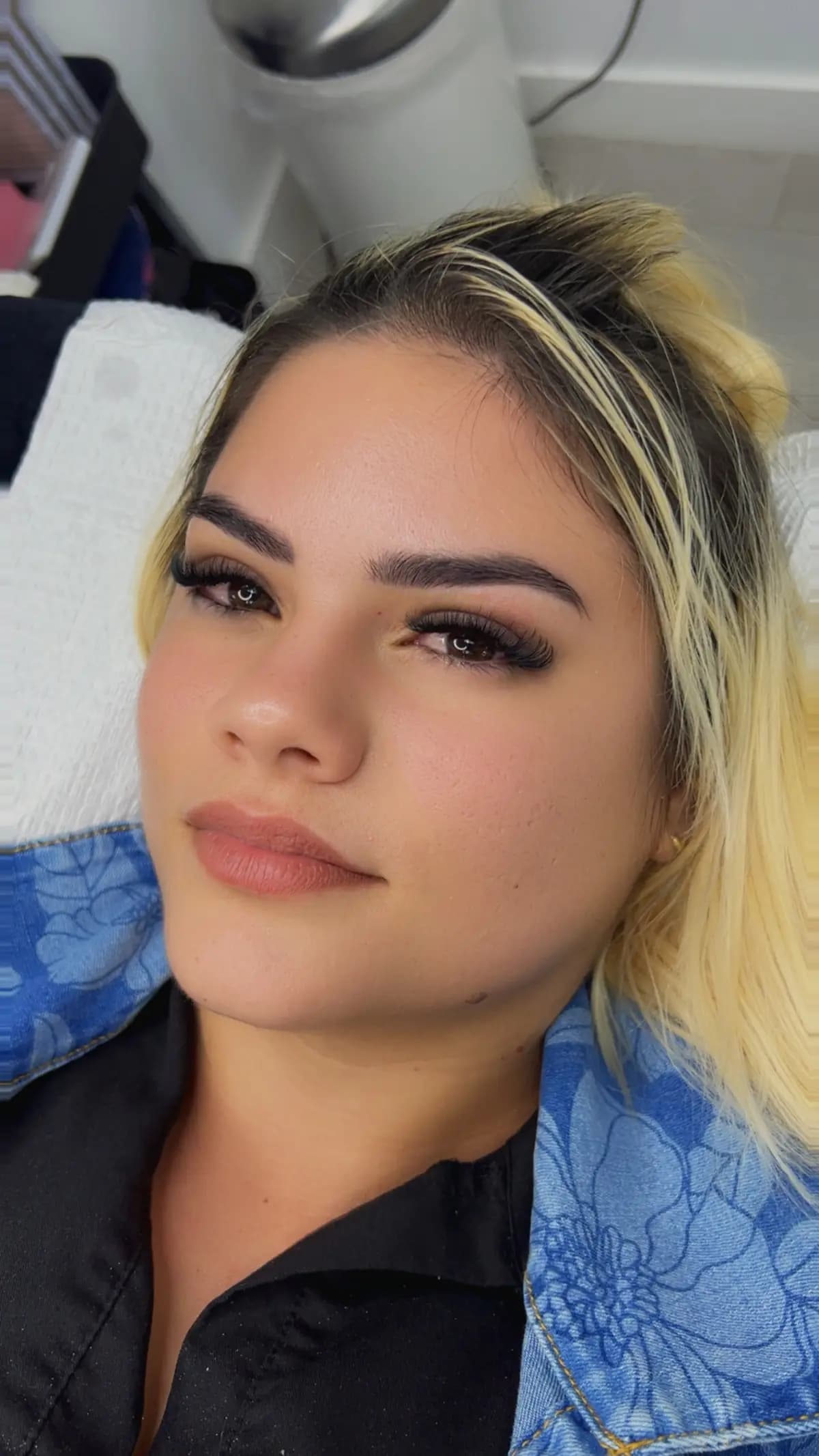 Close up of a client with extensions and worked brows