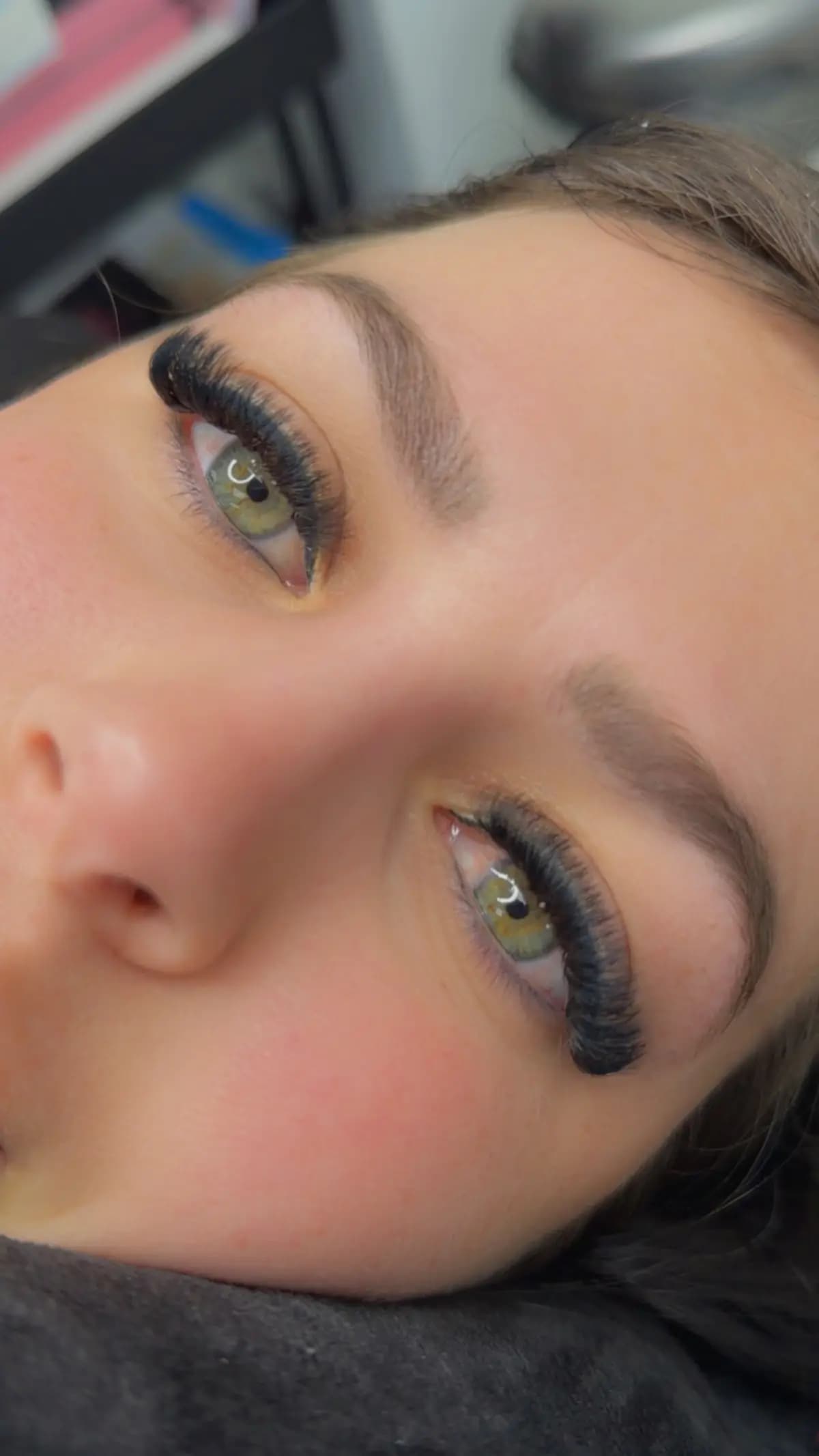 Brows shaped and tinted over light eyes