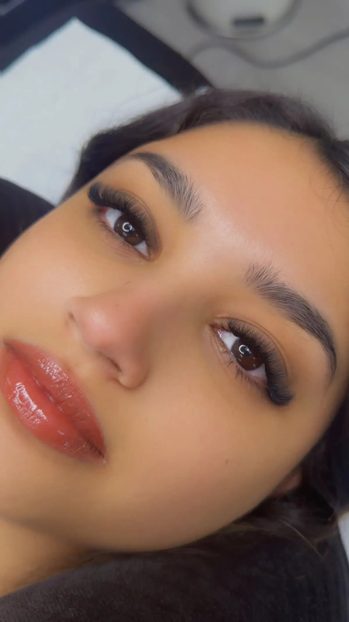 Thick brows defined with a clean lower line