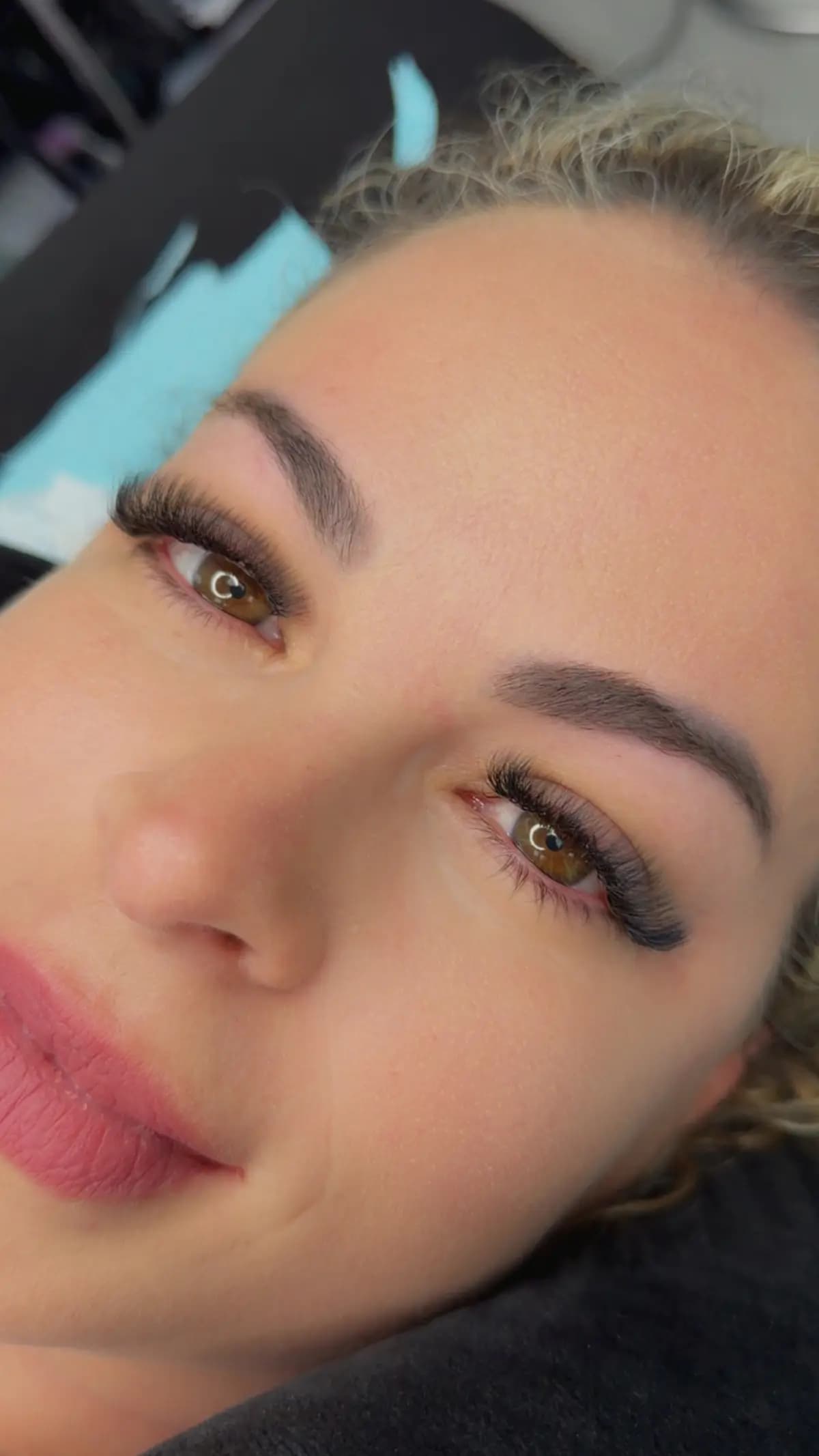 Brows shaped with a high arch and a brushed finish