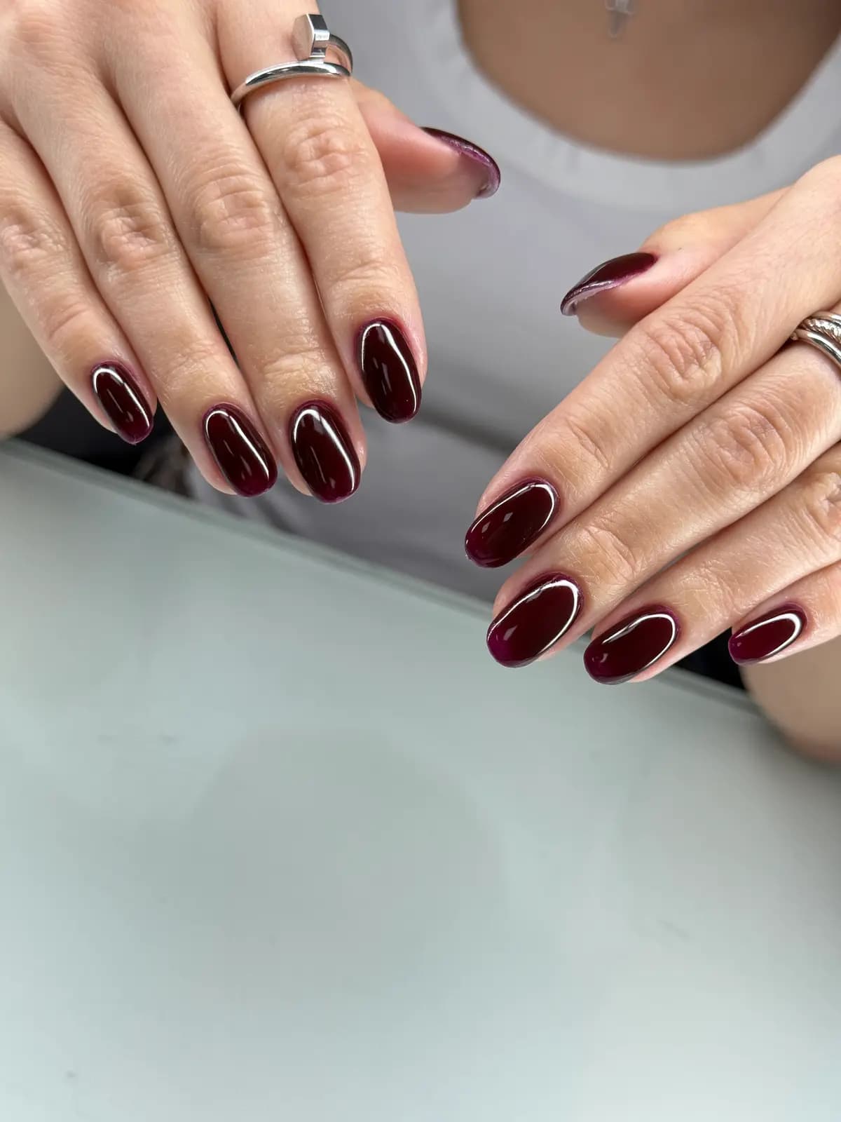 Almond nails in dark cherry red gel, both hands