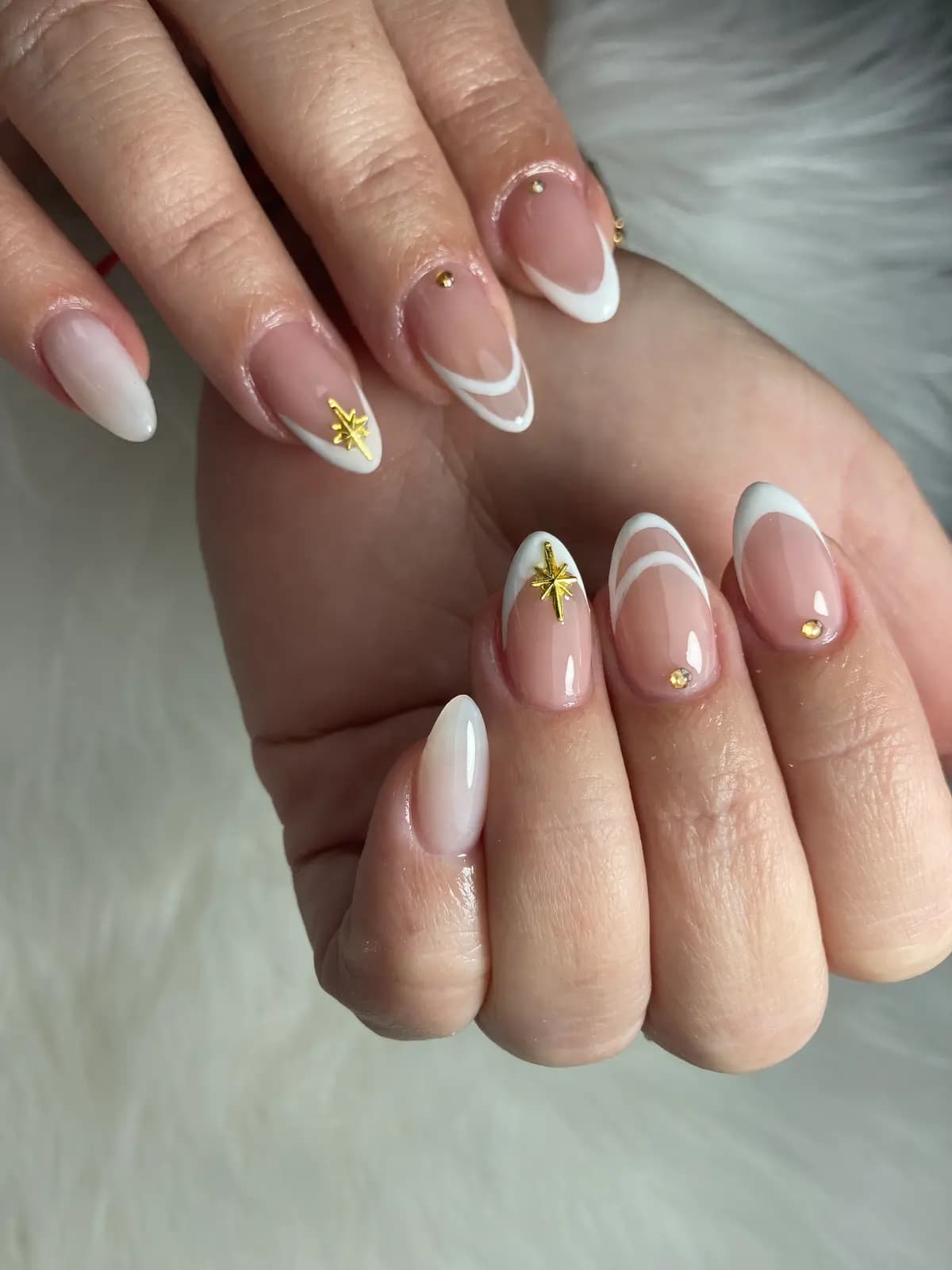 White french with painted gold stars on the accent nails