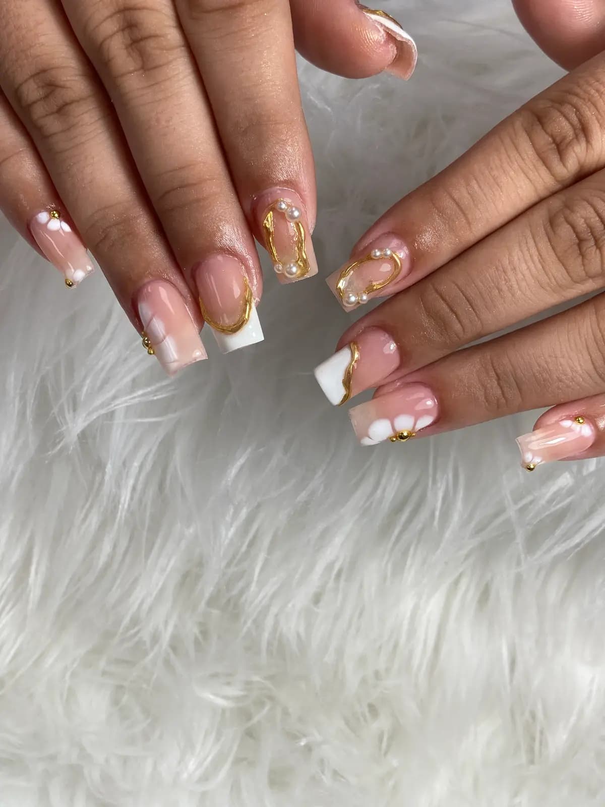 White french on long square nails with one gold glitter nail
