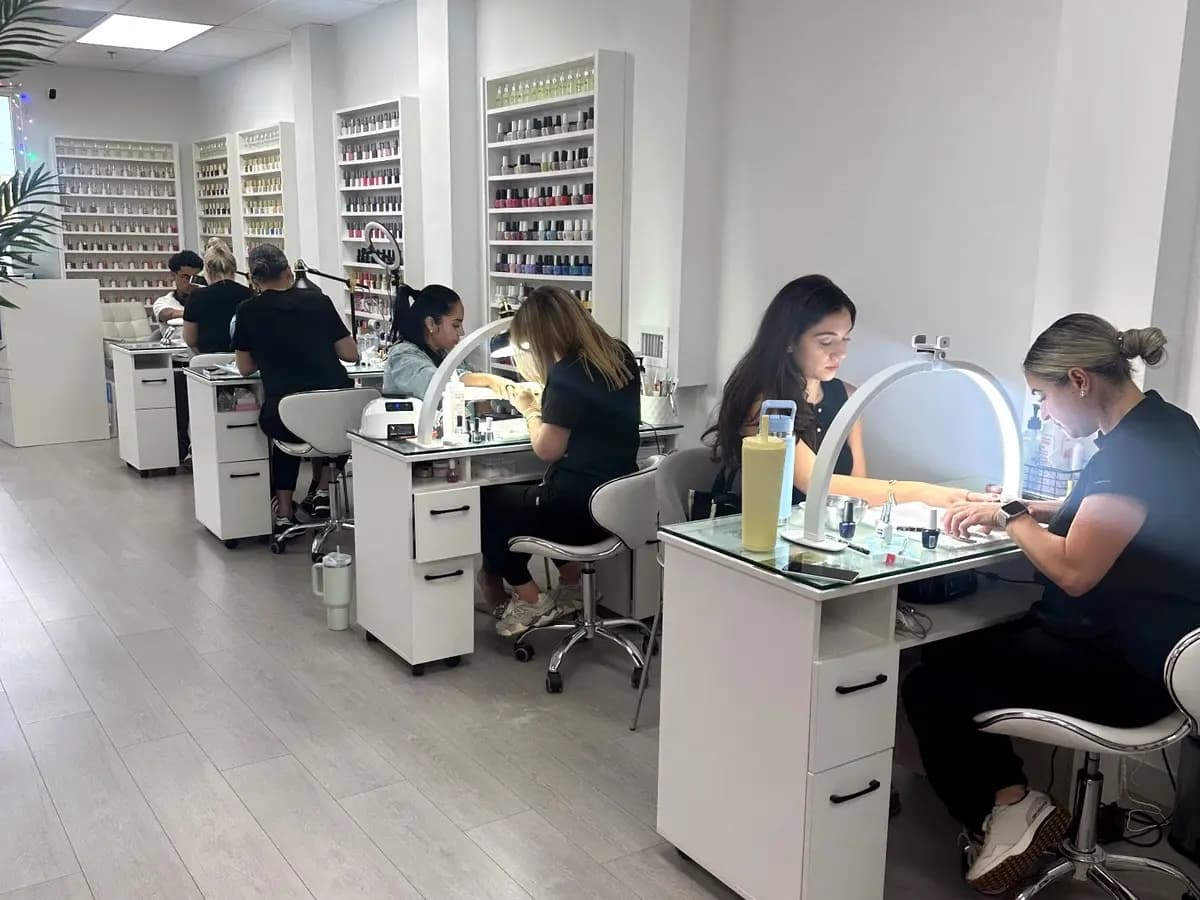 Manicure floor with stations in use and the polish wall at the back