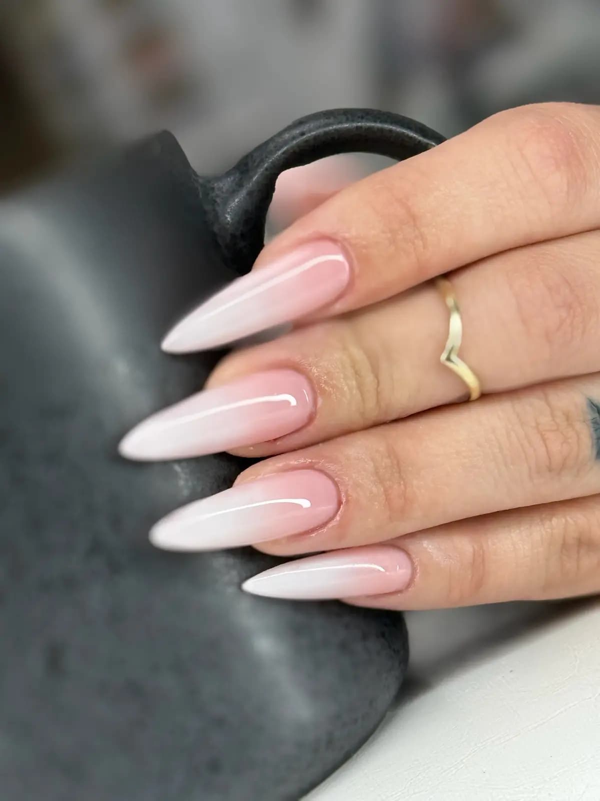 Pink-to-white fade on medium-length almond nails