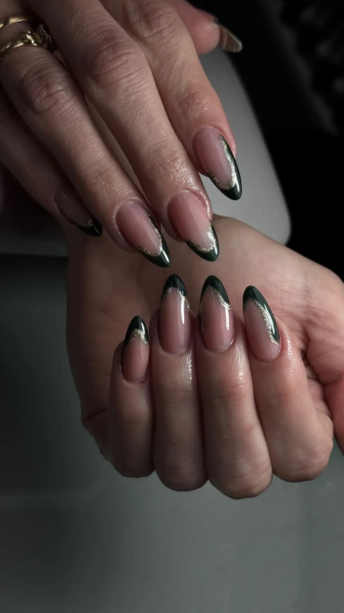 Dark green french on almond nails, thin tip