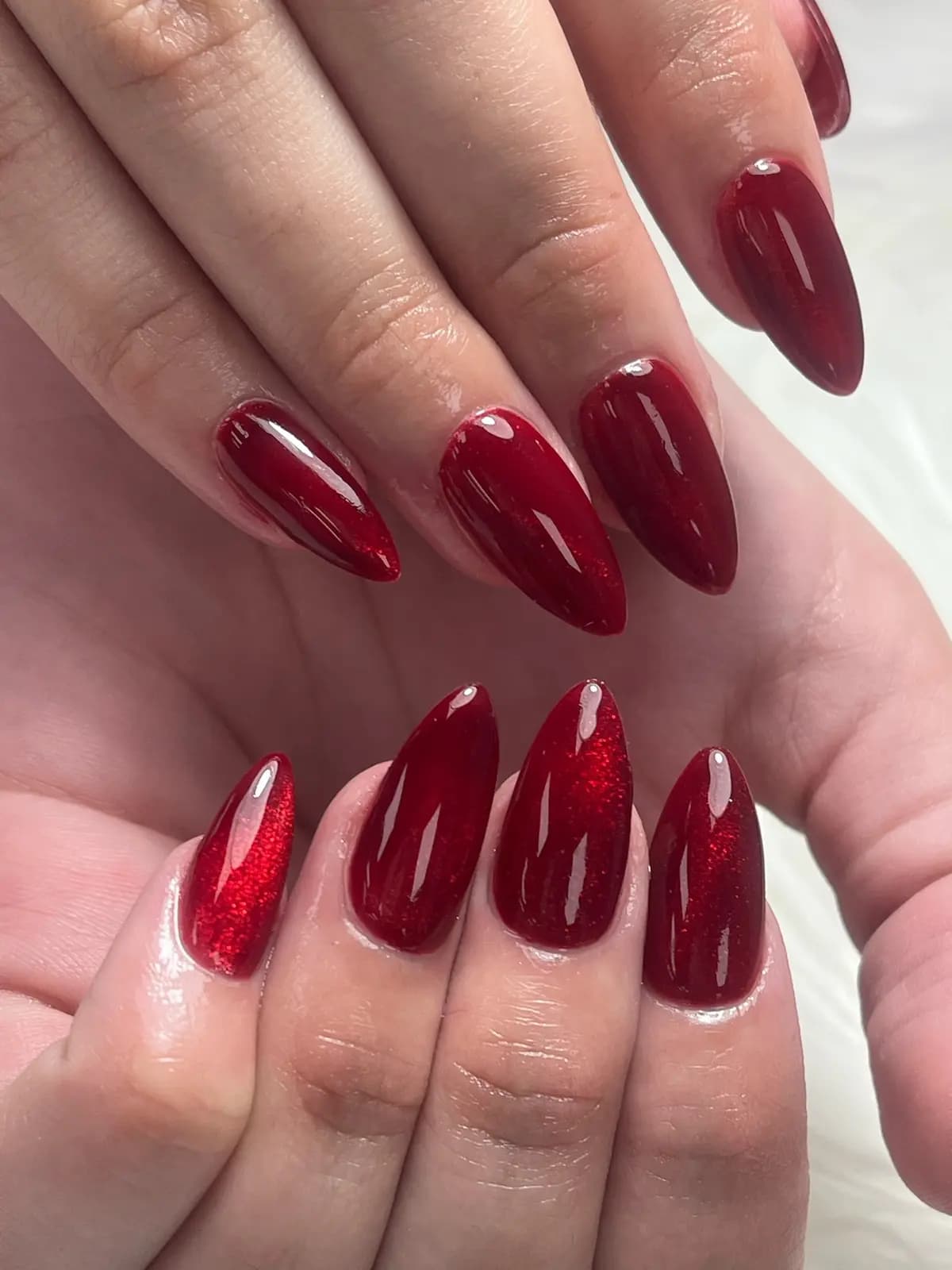 Extra-long coffin nails in bold red with a mirror shine