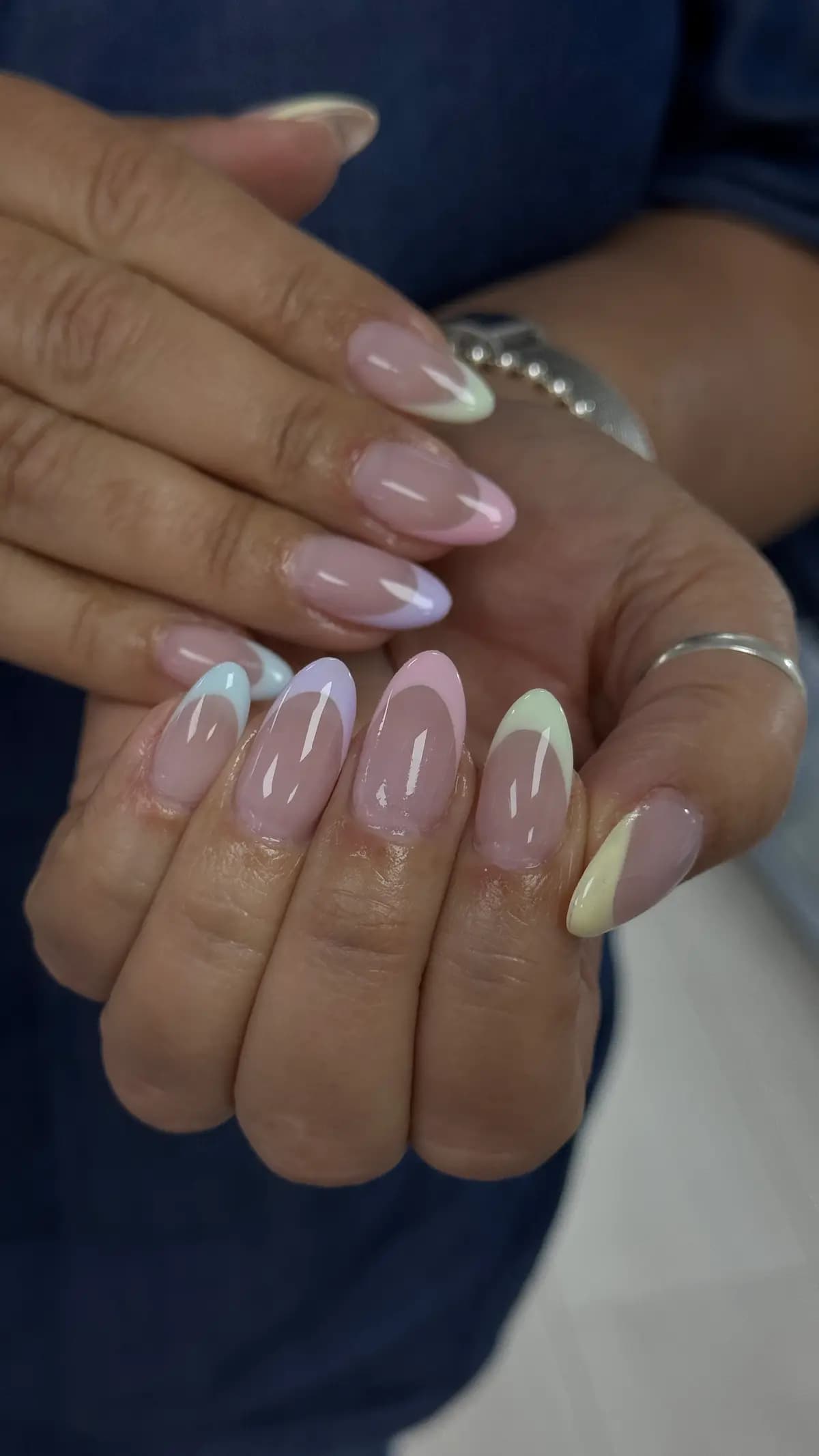 Milky pink almond nails with pearlescent accents
