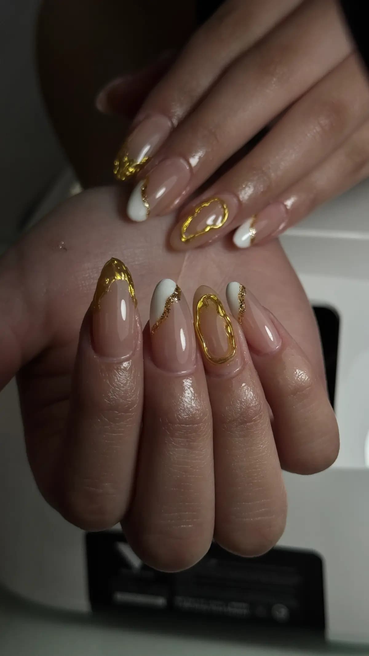Hand-applied gold foil over nude almond nails