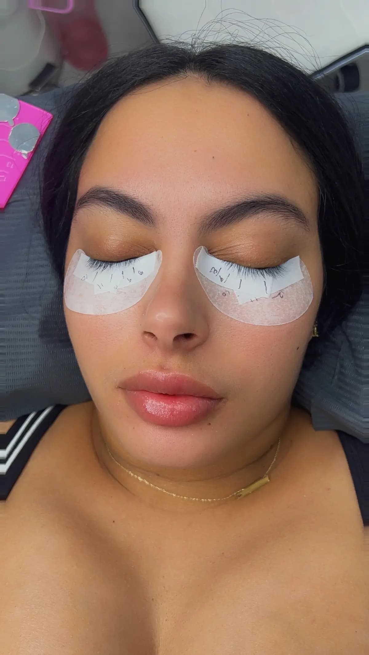 Client with pads in place during the lash appointment
