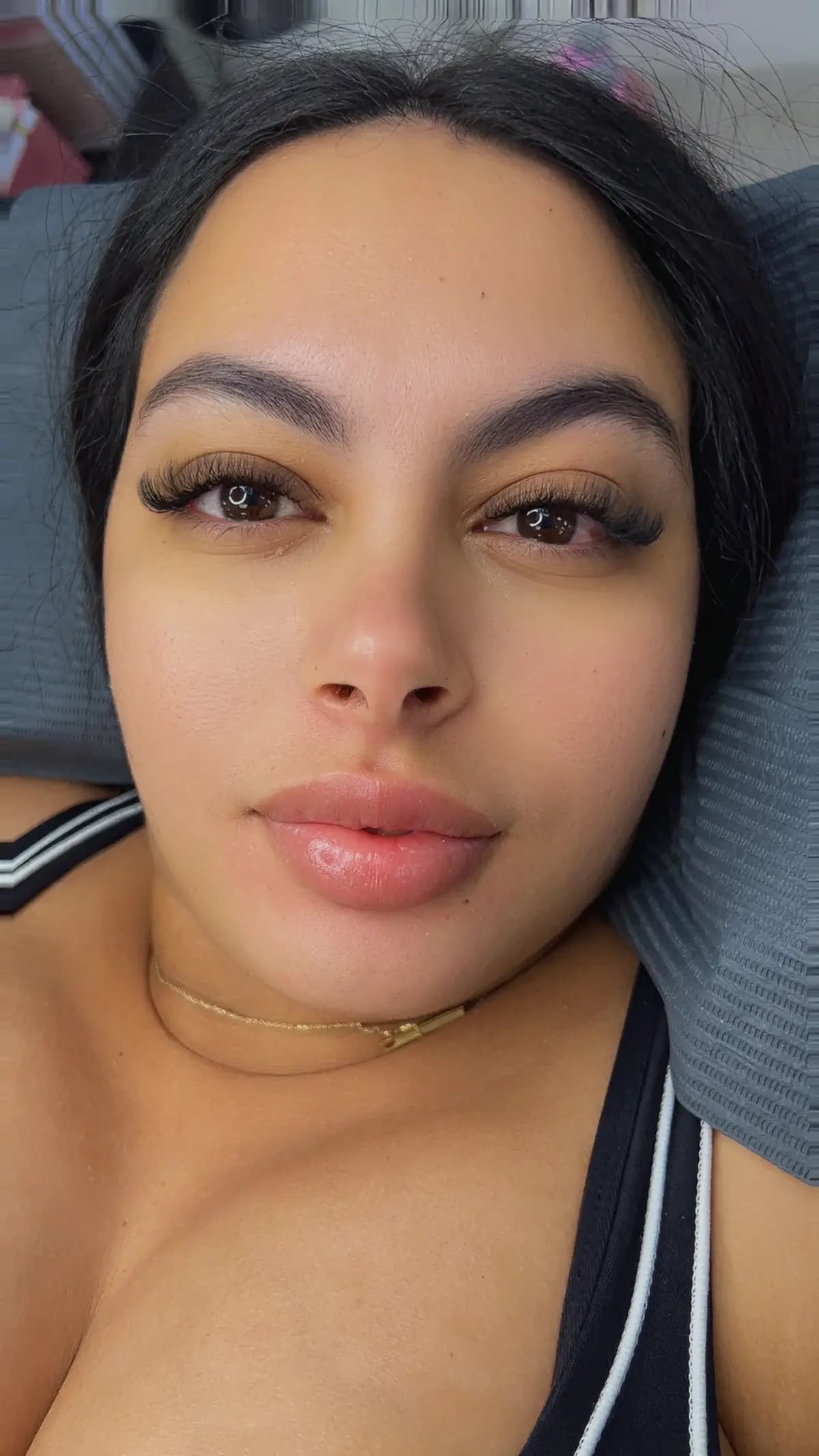 Client with volume extensions and thick, defined brows