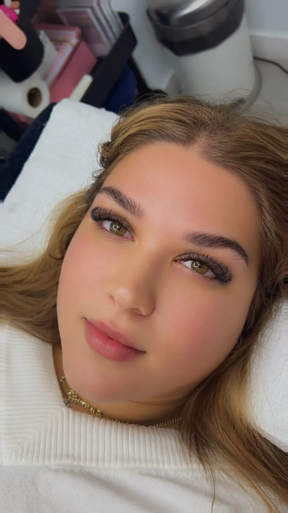 Blonde client with brows shaped and tinted a shade darker