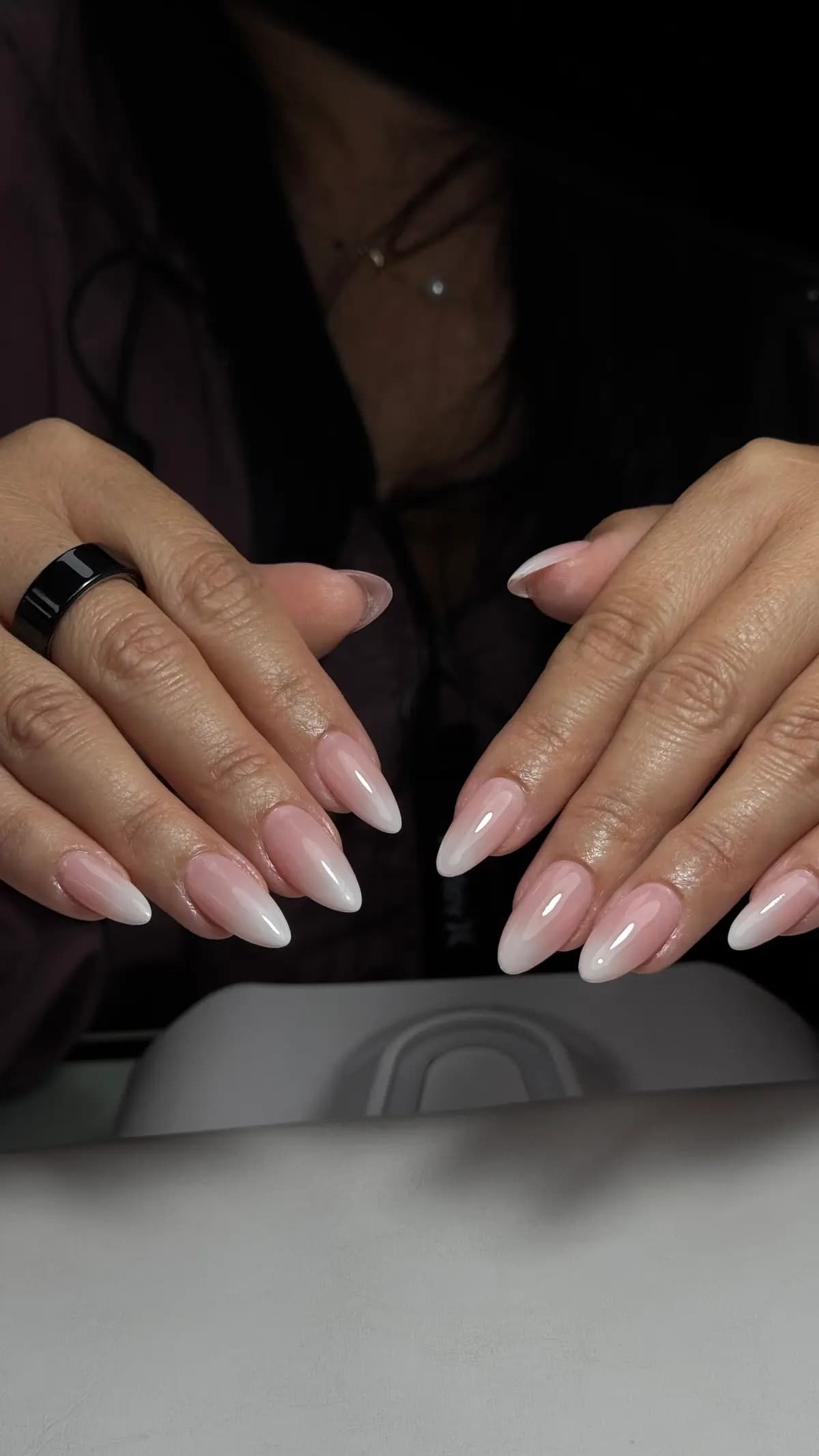 Baby boomer fade on long almond nails with a black ring
