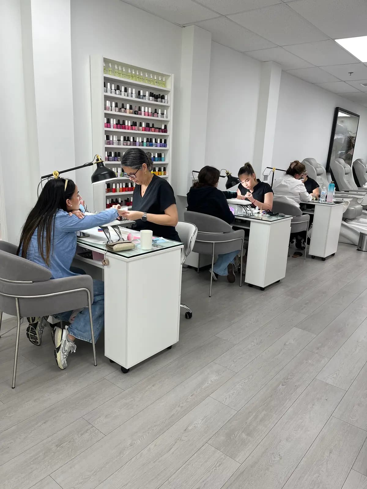 The salon floor on a normal day: technicians working several stations