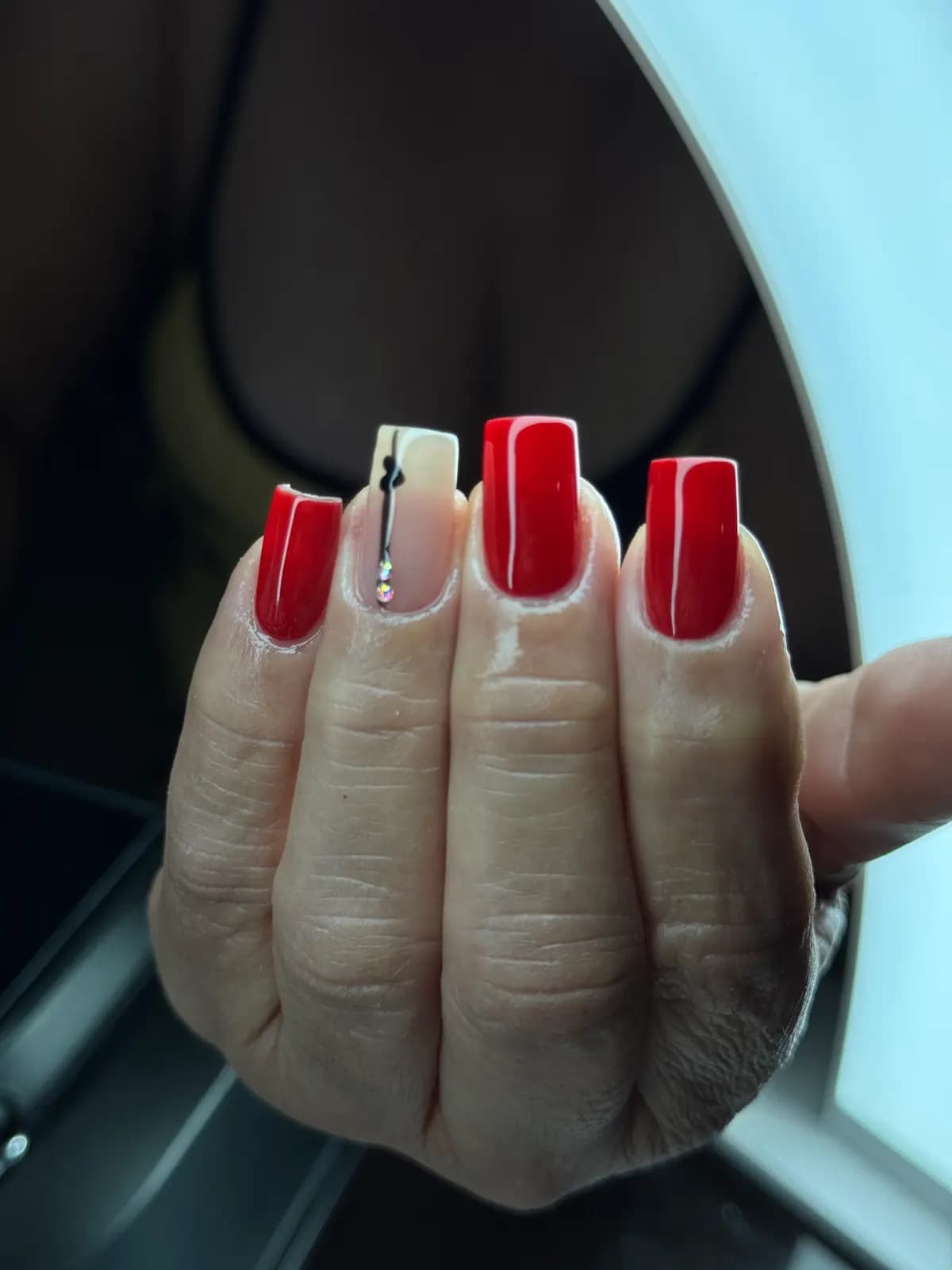 Long square nails in red with a metallic line detail