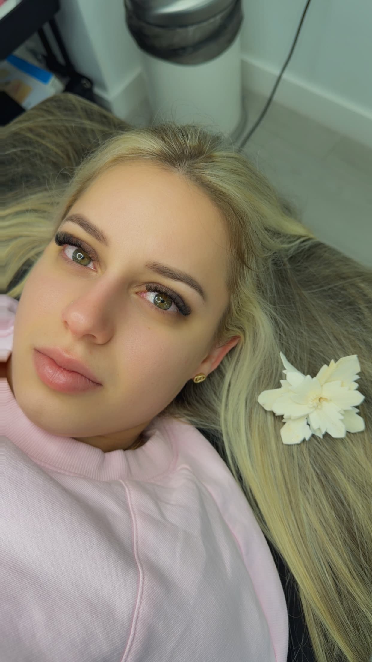 Classic eyelash set with a soft, natural finish on a blonde client, reclined on the salon bed in Hialeah, FL