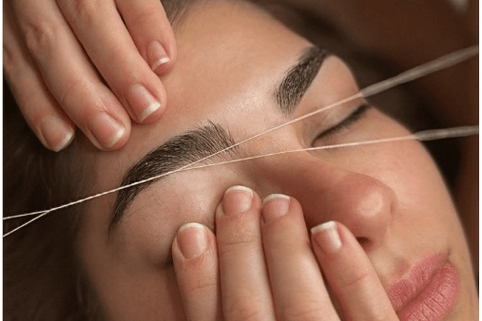 Brow shaping with thread on a defined eyebrow — brow services in Hialeah, FL