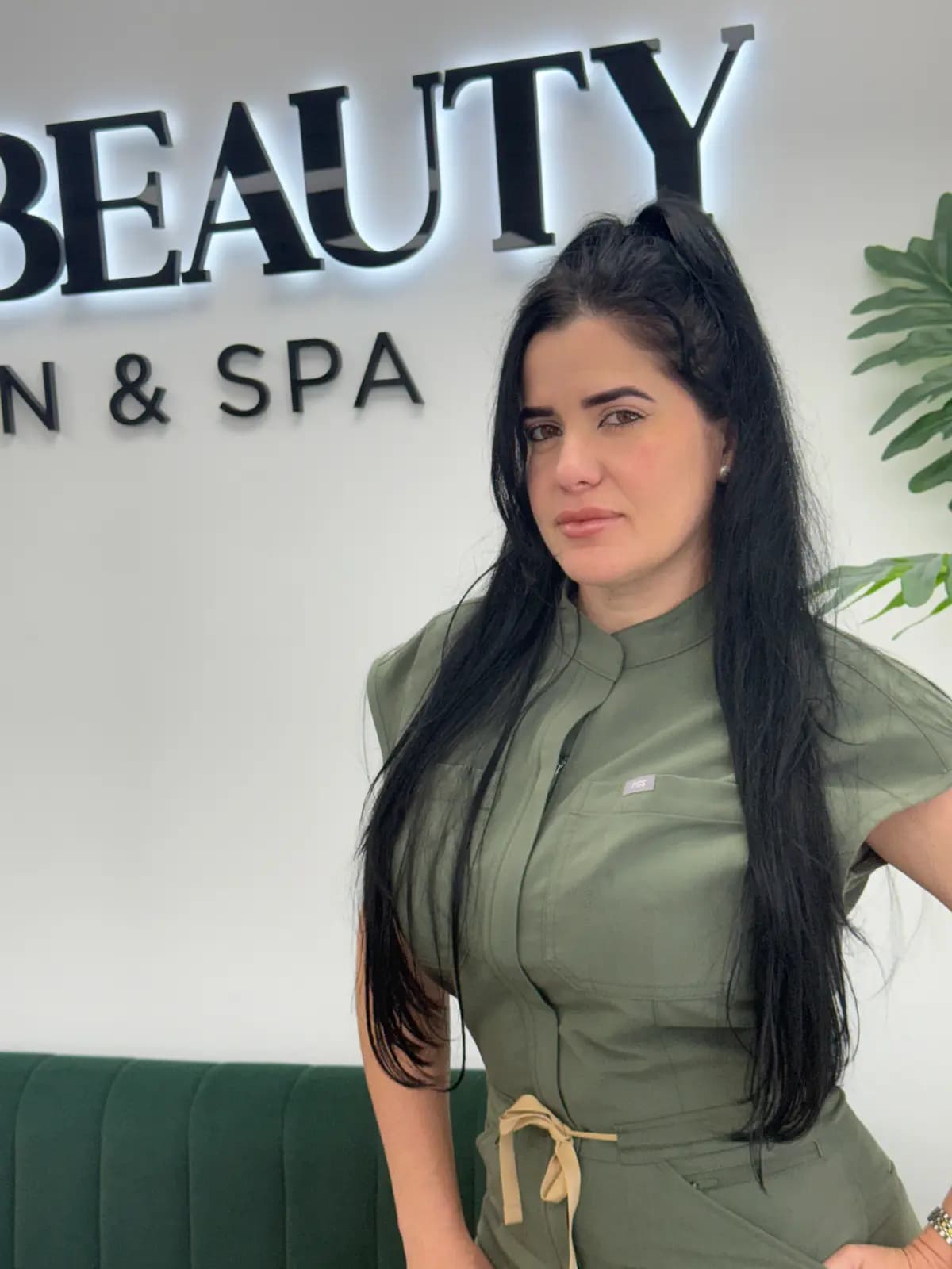 A technician from the Live Love Beauty Salon & Spa team at the salon reception in Hialeah, FL
